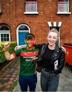 11 September 2021; Paralympic swimmer Ellen Keane jumps in for a photo with Mayo supporter Donnacha Togher, from Belmullet, Mayo prior to the GAA Football All-Ireland Senior Championship Final match between Mayo and Tyrone at Croke Park in Dublin. Photo by David Fitzgerald/Sportsfile