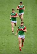 11 September 2021; Aidan O'Shea of Mayo, centre, runs out onto the pitch with team-mates Lee Keegan, left, and Conor Loftus during the GAA Football All-Ireland Senior Championship Final match between Mayo and Tyrone at Croke Park in Dublin. Photo by Stephen McCarthy/Sportsfile