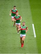 11 September 2021; Aidan O'Shea of Mayo, front, runs out onto the pitch with team-mates Lee Keegan and Conor Loftus, behind, before the GAA Football All-Ireland Senior Championship Final match between Mayo and Tyrone at Croke Park in Dublin. Photo by Stephen McCarthy/Sportsfile