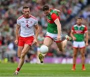 11 September 2021; Matthew Ruane of Mayo solos away from Brian Kennedy of Tyrone during the GAA Football All-Ireland Senior Championship Final match between Mayo and Tyrone at Croke Park in Dublin. Photo by Brendan Moran/Sportsfile