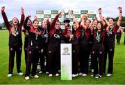 11 September 2021; Pembroke captain Mary Waldron lifts the cup with her team-mates after their victory in the Clear Currency Women’s All-Ireland T20 Cup Final match between Bready cricket club and Pembroke cricket club at Bready Cricket Club in Tyrone. Photo by Ben McShane/Sportsfile