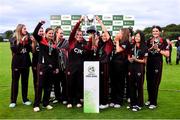 11 September 2021; Pembroke captain Mary Waldron lifts the cup with Clíona Tucker and her team-mates after their victory in the Clear Currency Women’s All-Ireland T20 Cup Final match between Bready cricket club and Pembroke cricket club at Bready Cricket Club in Tyrone. Photo by Ben McShane/Sportsfile