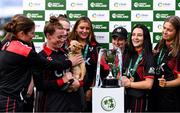 11 September 2021; Pembroke captain Mary Waldron with her team-mates after their victory in the Clear Currency Women’s All-Ireland T20 Cup Final match between Bready cricket club and Pembroke cricket club at Bready Cricket Club in Tyrone. Photo by Ben McShane/Sportsfile