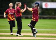 11 September 2021; Amy Campbell of Bready celebrates with team-mate Alana Dalzell, left, after taking the wicket of Louise Little of Pembroke during the Clear Currency Women’s All-Ireland T20 Cup Final match between Bready cricket club and Pembroke cricket club at Bready Cricket Club in Tyrone. Photo by Ben McShane/Sportsfile