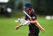 11 September 2021; Louise Little of Pembroke leaves the field of play after having her wicket taken by Amy Campbell of Bready during the Clear Currency Women’s All-Ireland T20 Cup Final match between Bready cricket club and Pembroke cricket club at Bready Cricket Club in Tyrone. Photo by Ben McShane/Sportsfile