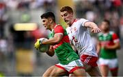 11 September 2021; Tommy Conroy of Mayo evades the tackle of Peter Harte of Tyrone during the GAA Football All-Ireland Senior Championship Final match between Mayo and Tyrone at Croke Park in Dublin. Photo by David Fitzgerald/Sportsfile