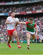 11 September 2021; Conor McKenna of Tyrone sets up his side's second goal despite the attempts of Lee Keegan of Mayo during the GAA Football All-Ireland Senior Championship Final match between Mayo and Tyrone at Croke Park in Dublin. Photo by Ramsey Cardy/Sportsfile