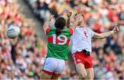 11 September 2021; Cathal McShane of Tyrone, right, beats Oisín Mullin of Mayo to the ball to score his side's first goal during the GAA Football All-Ireland Senior Championship Final match between Mayo and Tyrone at Croke Park in Dublin. Photo by Brendan Moran/Sportsfile