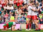 11 September 2021; Tyrone players Ronan McNamee, left, and Conor Meyler celebrate their side's victory at the final whistle, as Mayo's Ryan O'Donoghue reacts to defeat, after in the GAA Football All-Ireland Senior Championship Final match at Croke Park in Dublin. Photo by Seb Daly/Sportsfile