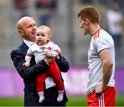 11 September 2021; Former All Ireland winning Tyrone captain Peter Canavan, holding ten month old Ava Hearte, while in conversation Peter Harte of Tyrone after the GAA Football All-Ireland Senior Championship Final match between Mayo and Tyrone at Croke Park in Dublin. Photo by Ray McManus/Sportsfile