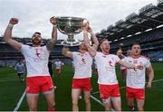 11 September 2021; Tyrone players, from left, Ronan McNamee, Cathal McShane, Frank Burns and Niall Kelly celebrate with the Sam Maguire Cup after the GAA Football All-Ireland Senior Championship Final match between Mayo and Tyrone at Croke Park in Dublin. Photo by Ramsey Cardy/Sportsfile