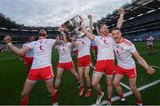 11 September 2021; Tyrone players, from left, Ronan McNamee, Cathal McShane, Frank Burns and Niall Kelly celebrate with the Sam Maguire Cup after the GAA Football All-Ireland Senior Championship Final match between Mayo and Tyrone at Croke Park in Dublin. Photo by Ramsey Cardy/Sportsfile