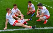 11 September 2021; Peter Harte of Tyrone with his ten month old daughter Ava and team mates Conor Meyler, Darragh Canavan and Matthew Donnelly after the GAA Football All-Ireland Senior Championship Final match between Mayo and Tyrone at Croke Park in Dublin. Photo by Ray McManus/Sportsfile