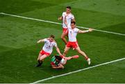 11 September 2021; Pádraig O'Hora of Mayo is fouled by Peter Harte, left, and Kieran McGeary of Tyrone, which referee Joe McQuillan awarded a 13m free for during the GAA Football All-Ireland Senior Championship Final match between Mayo and Tyrone at Croke Park in Dublin. Photo by Daire Brennan/Sportsfile