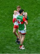 11 September 2021; Peter Harte of Tyrone holding his 10 month old daughter Ava, with Kevin McLoughlin of Mayo and his nine month old daughter Saorla after the GAA Football All-Ireland Senior Championship Final match between Mayo and Tyrone at Croke Park in Dublin. Photo by Daire Brennan/Sportsfile