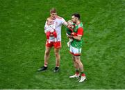 11 September 2021; Peter Harte of Tyrone, holding his ten month old daughter Ava, with Kevin McLoughlin of Mayo and his nine month old daughter Saorla, after the GAA Football All-Ireland Senior Championship Final match between Mayo and Tyrone at Croke Park in Dublin. Photo by Daire Brennan/Sportsfile