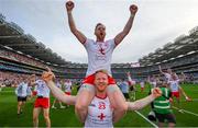11 September 2021; Frank Burns is held aloft in celebration by his Tyrone team-mate Hugh Pat McGeary following the GAA Football All-Ireland Senior Championship Final match between Mayo and Tyrone at Croke Park in Dublin. Photo by Stephen McCarthy/Sportsfile