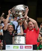 11 September 2021; Tyrone joint-managers Brian Dooher, left, and Feargal Logan lift the Sam Maguire Cup following the GAA Football All-Ireland Senior Championship Final match between Mayo and Tyrone at Croke Park in Dublin. Photo by Stephen McCarthy/Sportsfile