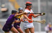 12 September 2021; Bernie Murray of Armagh in action against Aoife Dunne of Wexford during the All-Ireland Premier Junior Camogie Championship Final match between Armagh and Wexford at Croke Park in Dublin. Photo by Ben McShane/Sportsfile