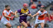 12 September 2021; Ciara Banville of Wexford in action against Gráinne McWilliams, left, and Nicola Woods of Armagh during the All-Ireland Premier Junior Camogie Championship Final match between Armagh and Wexford at Croke Park in Dublin. Photo by Piaras Ó Mídheach/Sportsfile