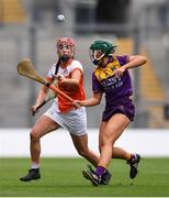 12 September 2021; Leanne Donnelly of Armagh in action against Roisin Cooney of Wexford during the All-Ireland Premier Junior Camogie Championship Final match between Armagh and Wexford at Croke Park in Dublin. Photo by Ben McShane/Sportsfile