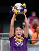 12 September 2021; Ciara Donohoe of Wexford lifts The Kathleen Mills Cup after the All-Ireland Premier Junior Camogie Championship Final match between Armagh and Wexford at Croke Park in Dublin. Photo by Ben McShane/Sportsfile