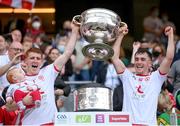 11 September 2021; Tyrone's Peter Harte, holding daughter Ava, and Darragh Canavan lift the Sam Maguire Cup following the GAA Football All-Ireland Senior Championship Final match between Mayo and Tyrone at Croke Park in Dublin. Photo by Stephen McCarthy/Sportsfile
