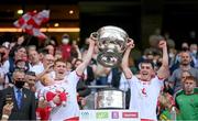11 September 2021; Tyrone's Peter Harte, holding daughter Ava, and Darragh Canavan lift the Sam Maguire Cup following the GAA Football All-Ireland Senior Championship Final match between Mayo and Tyrone at Croke Park in Dublin. Photo by Stephen McCarthy/Sportsfile