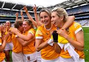 12 September 2021; Antrim players Niamh Donnelly, right, and Becky Ellis, second from right, celebrate after their side's victory in the All-Ireland Intermediate Camogie Championship Final match between Antrim and Kilkenny at Croke Park in Dublin. Photo by Piaras Ó Mídheach/Sportsfile