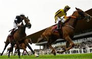 12 September 2021; Jockey Ben Coen, right, celebrates as he crosses the line to win the Comer Group International Irish St. Leger on Sonnyboyliston, from second place Twilight Payment, with Declan McDonogh up, during day two of the Longines Irish Champions Weekend at The Curragh Racecourse in Kildare. Photo by Seb Daly/Sportsfile