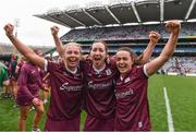 12 September 2021; Galway players, from left, Sarah Spellman, Catriona Cormican and Siobhán McGrath celebrate after their victory in the All-Ireland Senior Camogie Championship Final match between Cork and Galway at Croke Park in Dublin. Photo by Ben McShane/Sportsfile