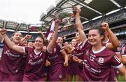 12 September 2021; Galway players Siobhán McGrath, left, and Aoife Donoghue lift The O'Duffy Cup with their team-mates after their victory in the All-Ireland Senior Camogie Championship Final match between Cork and Galway at Croke Park in Dublin. Photo by Ben McShane/Sportsfile