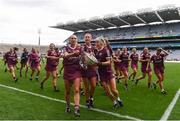 12 September 2021; Galway players, from left, Niamh Kilkenny, Sarah Dervan and Siobhán Gardiner celebrate with The O'Duffy Cup after their victory in the All-Ireland Senior Camogie Championship Final match between Cork and Galway at Croke Park in Dublin. Photo by Ben McShane/Sportsfile
