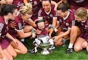12 September 2021; Éanna Kelly, son of Galway physiotherapist Clíodhna Ní Choisdealbha, celebrates in the O'Duffy Cup after the All-Ireland Senior Camogie Championship Final match between Cork and Galway at Croke Park in Dublin. Photo by Piaras Ó Mídheach/Sportsfile