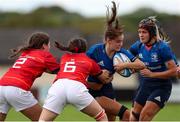 11 September 2021; Eva Sterrit of Leinster is tackled by Kira Fitzgerald, and Robyn McKenna of Munster during the PwC U18 Women’s Interprovincial Championship Round 3 match between Leinster and Munster at MU Barnhall in Leixlip, Kildare. Photo by Michael P Ryan/Sportsfile