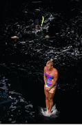 12 September 2021; A scuba diver watches on at Rhiannan Iffland of Australia during round four of the Red Bull Cliff Diving World Series at Downpatrick Head in Mayo. Photo by Ramsey Cardy/Sportsfile