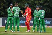 13 September 2021; Brendan Taylor of Zimbabwe is given a guard of honour by Ireland players as he makes his way onto the field of play for his last international match beforeduring match three of the Dafanews International Cup ODI series between Ireland and Zimbabwe at Stormont in Belfast. Photo by Seb Daly/Sportsfile