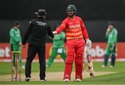 13 September 2021; Brendan Taylor of Zimbabwe shakes hands with umpire Alan Neill during match three of the Dafanews International Cup ODI series between Ireland and Zimbabwe at Stormont in Belfast. Photo by Seb Daly/Sportsfile