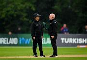 13 September 2021; Umpires Paul Reynolds, left, and Alan Neill in conversation before taking the players from the field due to rain during match three of the Dafanews International Cup ODI series between Ireland and Zimbabwe at Stormont in Belfast. Photo by Seb Daly/Sportsfile
