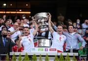 11 September 2021; Tyrone players, from left, Niall Kelly, Ben McDonnell and Darragh McAnenly lift the Sam Maguire Cup following the GAA Football All-Ireland Senior Championship Final match between Mayo and Tyrone at Croke Park in Dublin. Photo by Stephen McCarthy/Sportsfile