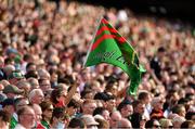 11 September 2021; A Mayo supporter waves her flag during the GAA Football All-Ireland Senior Championship Final match between Mayo and Tyrone at Croke Park in Dublin. Photo by Ray McManus/Sportsfile