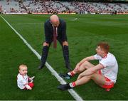 11 September 2021; Former Tyrone All Ireland winning captain Peter Canavan in conversation with his son in law Peter Harte of Tyrone and his 10 month old grandchild Ava after the GAA Football All-Ireland Senior Championship Final match between Mayo and Tyrone at Croke Park in Dublin. Photo by Ray McManus/Sportsfile