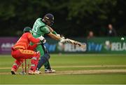 13 September 2021; Andrew Balbirnie of Ireland plays a shot, watched by Zimbabwe wicketkeeper Regis Chakabva, during match three of the Dafanews International Cup ODI series between Ireland and Zimbabwe at Stormont in Belfast. Photo by Seb Daly/Sportsfile