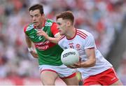 11 September 2021; Conor Meyler of Tyrone in action against Stephen Coen of Mayo during the GAA Football All-Ireland Senior Championship Final match between Mayo and Tyrone at Croke Park in Dublin.Amhrán na bhFiann Photo by Brendan Moran/Sportsfile