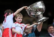 11 September 2021; Tyrone strength and conditioning coach Peter Donnelly and family celebrate with the Sam Maguire Cup after the GAA Football All-Ireland Senior Championship Final match between Mayo and Tyrone at Croke Park in Dublin. Photo by Piaras Ó Mídheach/Sportsfile