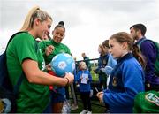 15 September 2021; Savannah McCarthy, left, and Rianna Jarrett sign a DLR Waves football for Ally Browne of Rosemount Mulvey FC following a Republic of Ireland training session at the FAI National Training Centre in Abbotstown, Dublin. Photo by Stephen McCarthy/Sportsfile