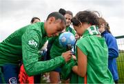 15 September 2021; Rianna Jarrett signs a Republic of Ireland jersey for Natalie Kayanan-Ranallo of Rosemount Mulvey FC following a Republic of Ireland training session at the FAI National Training Centre in Abbotstown, Dublin. Photo by Stephen McCarthy/Sportsfile
