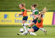 15 September 2021; Emily Whelan is tackled by Jamie Finn during a Republic of Ireland training session at the FAI National Training Centre in Abbotstown, Dublin. Photo by Stephen McCarthy/Sportsfile