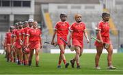 12 September 2021; The Cork team, lead by Linda Collins, right, during the pre-match parade before the All-Ireland Senior Camogie Championship Final match between Cork and Galway at Croke Park in Dublin. Photo by Ben McShane/Sportsfile