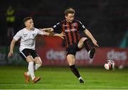 17 September 2021; Conor Levingston of Bohemians in action against Paddy O'Sullivan of Maynooth University Town during the extra.ie FAI Cup Quarter-Final match between Bohemians and Maynooth University Town at Dalymount Park in Dublin. Photo by Stephen McCarthy/Sportsfile